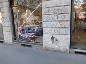 A vandalized shopfront in central Milan.